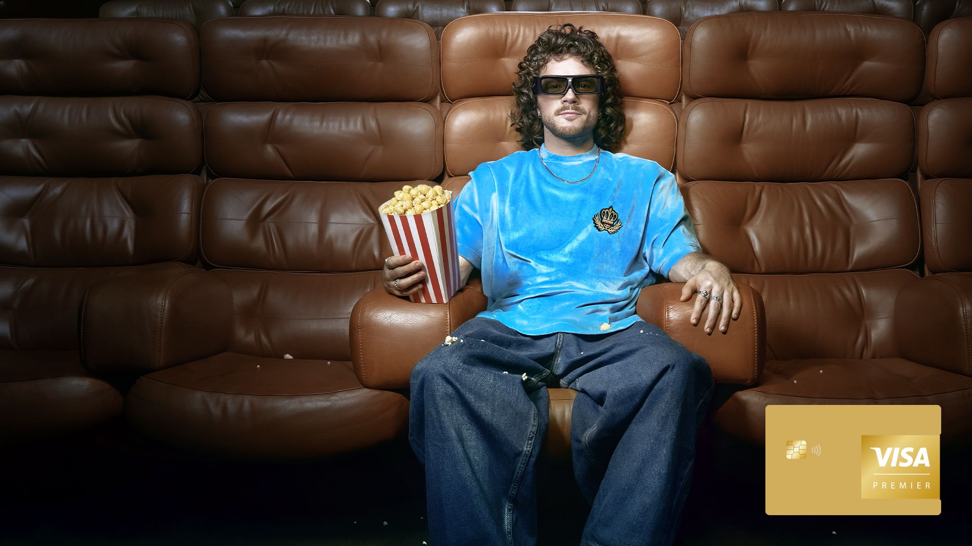 man at cinema holding popcorn
