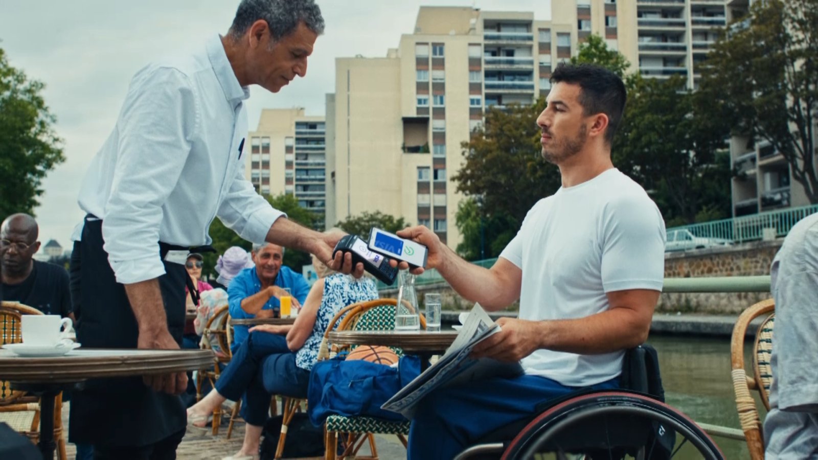 man in wheelchair making card payment