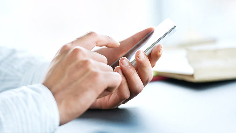 175531171 Smart phone in man’s hands