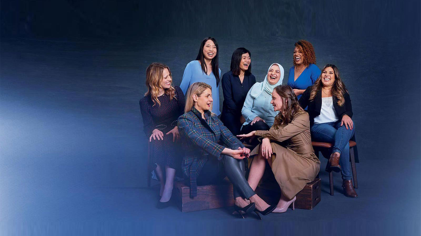 women entrepreneurs seated together laughing