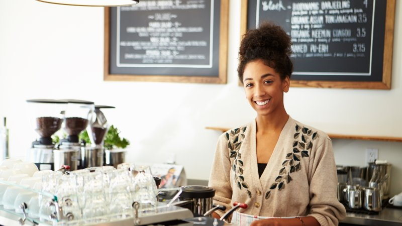Woman serving at coffee shop